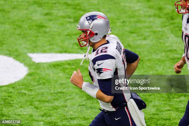 New England Patriots quarterback Tom Brady warms up on the field prior to Super Bowl LI on February 5 at NRG Stadium in Houston, TX.