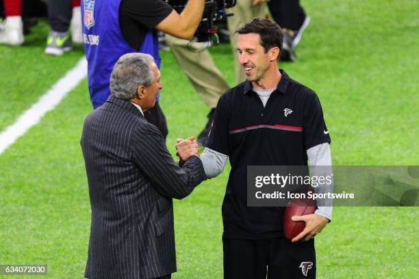 Atlanta Falcons owner Arthur Blank talks with Atlanta Falcons offensive coordinator Kyle Shanahan on the field prior to Super Bowl LI on February 5...