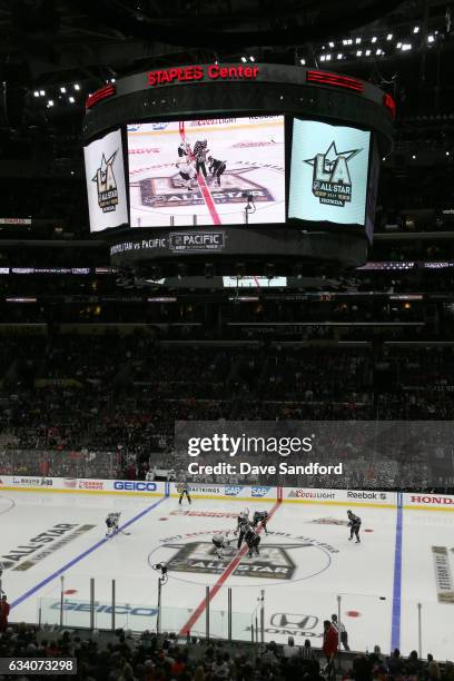 Sidney Crosby of the Pittsburgh Penguins and Jeff Carter of the Los Angeles Kings take the face-off at center ice during the 2017 Honda NHL All-Star...