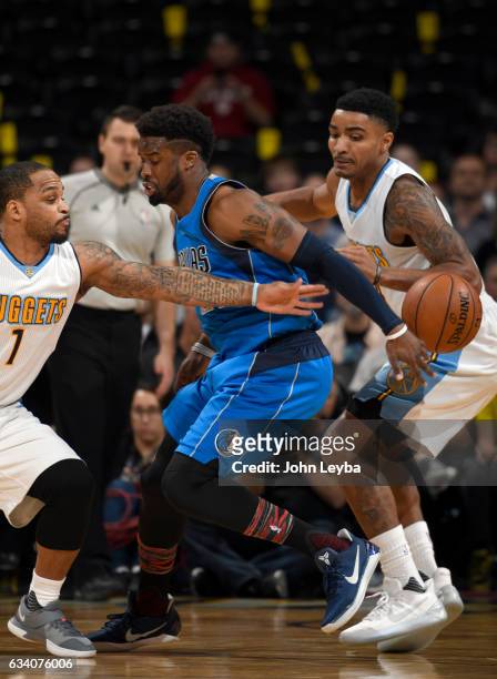Dallas Mavericks guard Wesley Matthews gets the ball poked away by Denver Nuggets guard Jameer Nelson during the first quarter February 6, 2017 at...