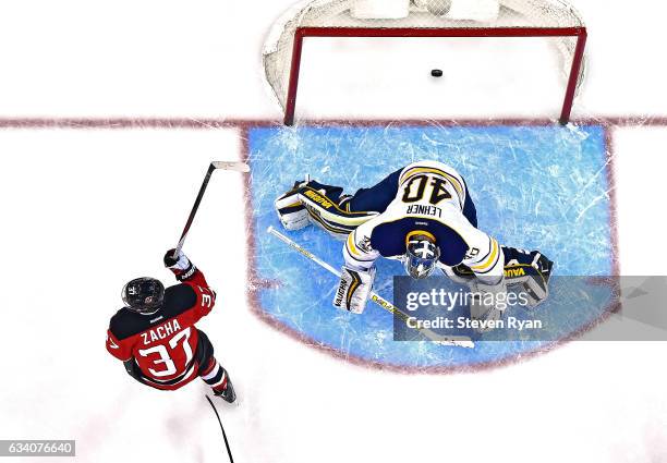 Pavel Zacha of the New Jersey Devils scores the eventual game winning goal past Robin Lehner of the Buffalo Sabres during the third period at...