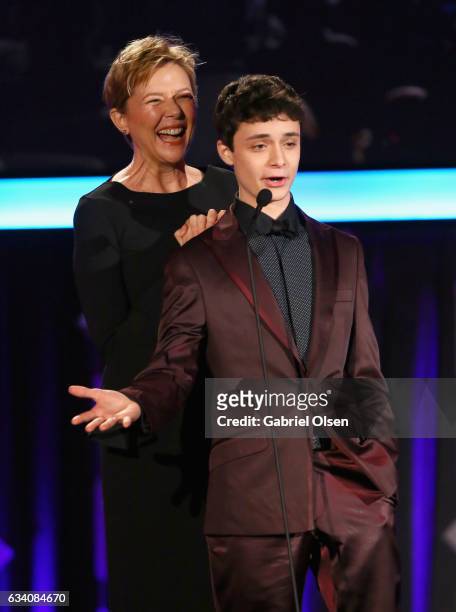 Presenters Annette Bening and Lucas Jade Zumann speak onstage at the 16th Annual AARP The Magazine's Movies For Grownups Awards at the Beverly...