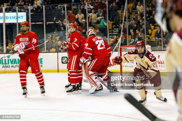 Boston College Eagles forward Matthew Gaudreau skates to celebrate with teammates and the Terriers regroup after an Eagles goal during the second...