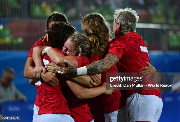 Ghislaine Landry of Canada celebrates with her team mates after scoring a try during the Women's Rugby Sevens Quarter Final match between Canada and...