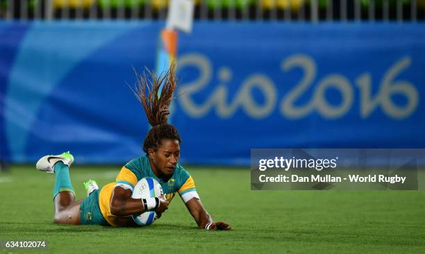 Ellia Green of Australia dives over for a try during the Women's Rugby Sevens Gold Medal match between Australia and New Zealand on day 3 of the Rio...