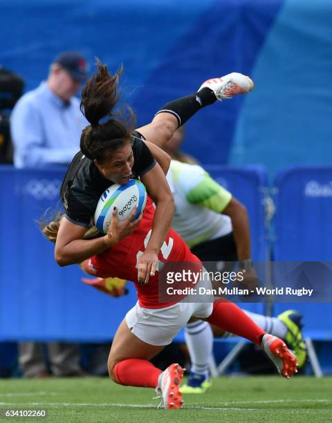 Ruby Tui of New Zealand is tackled in the air by Amy Wilson Hardy of Great Britain resulting in a yellow card during the Women's Rugby Sevens Semi...