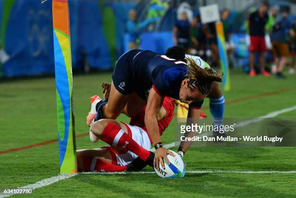Jade le Pesq of France holds off Ghislaine Landry of Canada to score a try during the Women's Rugby Sevens Quarter Final match between Canada and...
