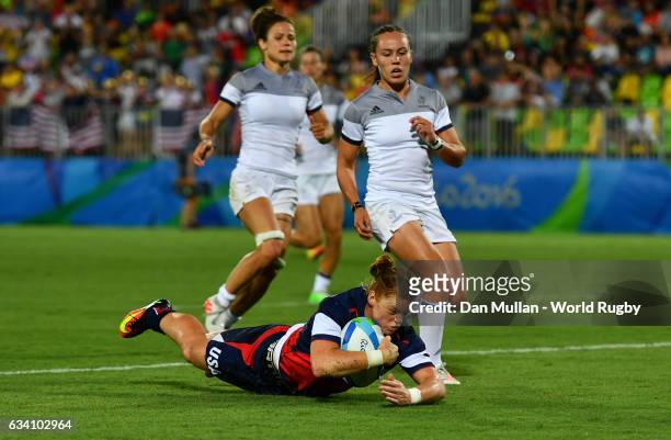 Alev Kelter of the United States dives over for a try during the Women's Rugby Sevens placing match between France and the United States on day 3 of...