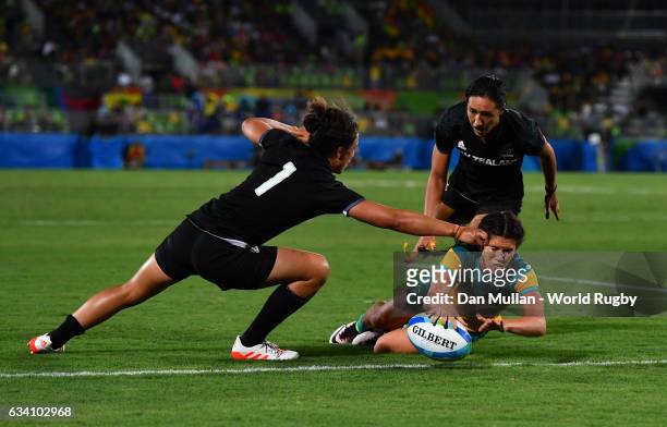Charlotte Caslick of Australia dives over for a try during the Women's Rugby Sevens Gold Medal match between Australia and New Zealand on day 3 of...
