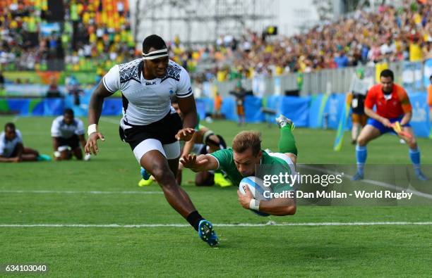 Felipe Claro of Brazil dives over for a try during the Men's Rugby Sevens Pool A match between Fiji and Brazil on Day 4 of the Rio 2016 Olympic Games...