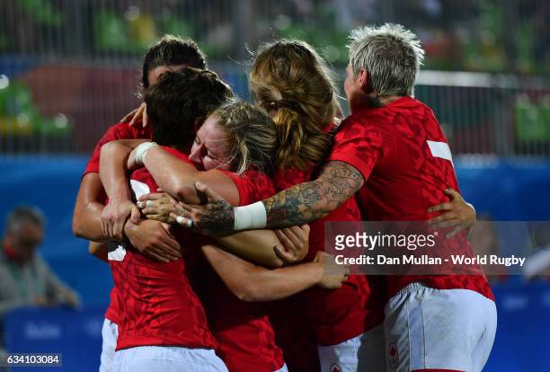 Ghislaine Landry of Canada celebrates with her team mates after scoring a try during the Women's Rugby Sevens Quarter Final match between Canada and...