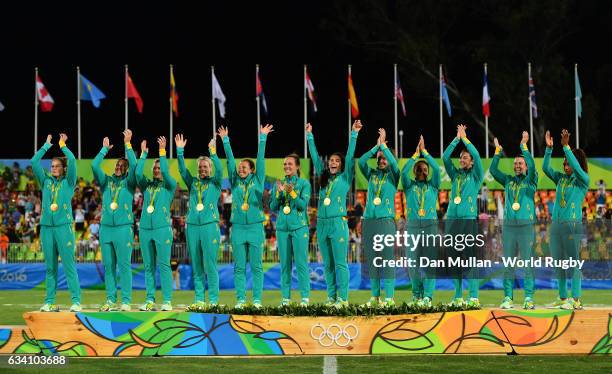 The Australia team pose with their gold medals following victory during the Women's Rugby Sevens Gold Medal match between Australia and New Zealand...