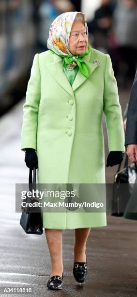 Queen Elizabeth II boards a train at King's Lynn Station to return to London after her Christmas break at Sandringham House. On February 7, 2017 in...