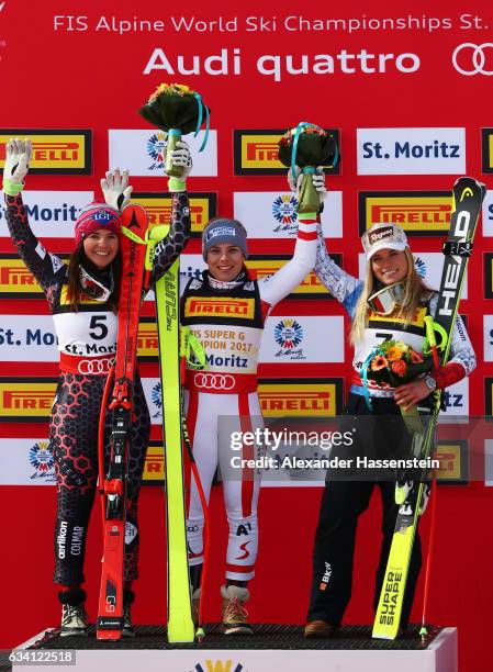Gold medallist Nicole Schmidhofer of Austria poses with silver medallist Tina Weirather of Liechtenstein and bronze medallist Lara Gut of Switzerland...