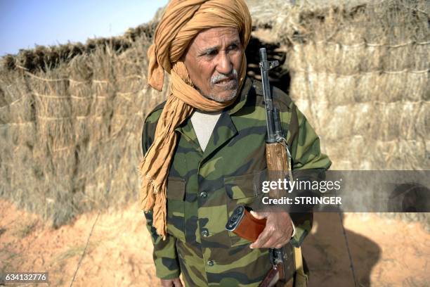 Bechir Mohamed, the chief of security in the Al-Mahbes area in the Western Sahara stands outside his hut on February 3, 2017. - It is the world's...