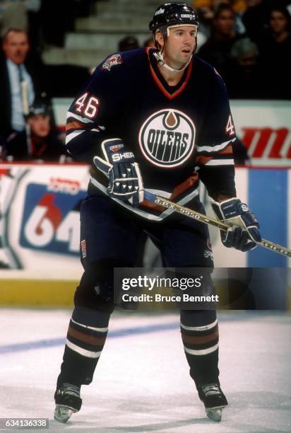 Todd Reirden of the Edmonton Oilers skates on the ice during an NHL game against the Toronto Maple Leafs circa 1997 at the Maple Leaf Garden in...