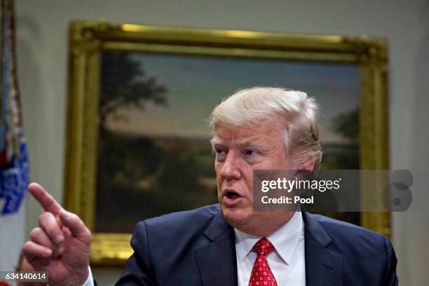 President Donald Trump speaks as he meets with county sheriffs during a listening session in the Roosevelt Room of the White House on February 7,...