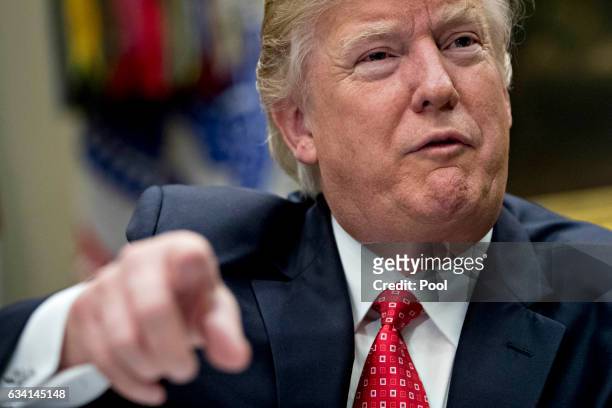 President Donald Trump speaks as he meets with county sheriffs during a listening session in the Roosevelt Room of the White House on February 7,...