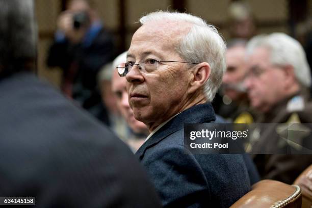 Dana Boente, acting U.S. Attorney general, listens during a county sheriff listening session with U.S. President Donald Trump, in the Roosevelt Room...