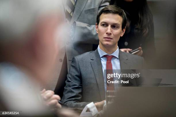 Jared Kushner, senior White House adviser, listens during a county sheriff listening session with U.S. President Donald Trump, in the Roosevelt Room...