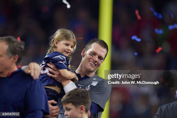 Super Bowl LI: New England Patriots QB Tom Brady victorious, holding daughter Vivian after winning game vs Atlanta Falcons Brian Poole at NRG...
