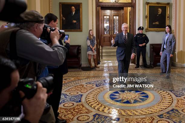 Senate Majority Leader Mitch McConnell , Republican-Kentucky, gives a thumbs up after US Vice President Mike Pence cast a tie-breaking vote, to...