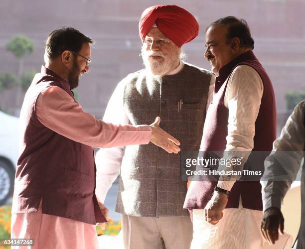 Minister of Human Resource Development Prakash Javadekar shakes hand with Minister of Chemicals and Fertilizers and Parliamentary Affairs Minister...