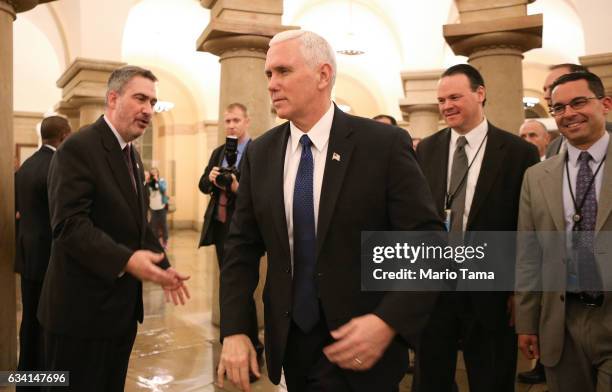 Vice President Mike Pence walks through the U.S. Capitol after the Senate voted to confirm Betsy DeVos as education secretary on Capitol Hill on...