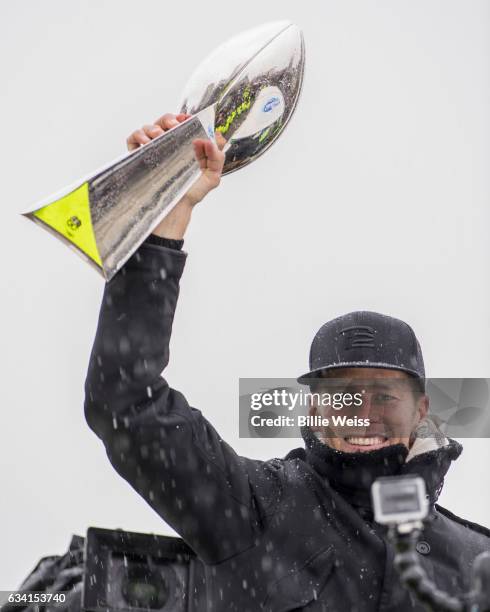 Quarterback Tom Brady of the New England Patriots holds the Vince Lombardi trophy during the Super Bowl victory parade on February 7, 2017 in Boston,...