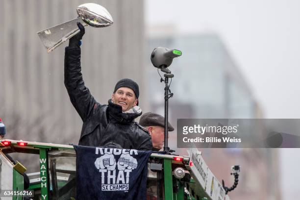 Quarterback Tom Brady of the New England Patriots holds the Vince Lombardi trophy during the Super Bowl victory parade on February 7, 2017 in Boston,...