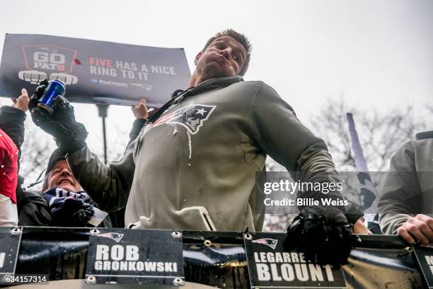 Rob Gronkowski of the New England Patriots spikes a beer can during the Super Bowl victory parade on February 7, 2017 in Boston, Massachusetts. The...