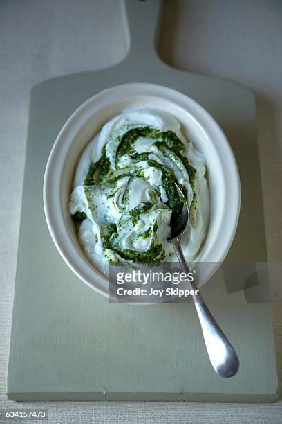 yoghurt with pesto swirls - yogurt swirl stock pictures, royalty-free photos & images