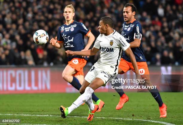 Monaco's French forward Kylian Mbappe Lottin vies with Montpellier's Brazilian defender Victorio Hilton and Montpellier's Czech defender Lukas...