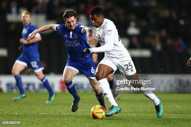 Chuks Aneke of Milton Keynes Dons attempts to move away with the ball under pressure from Aiden O'Neill of Oldham Athletic during the Sky Bet League...