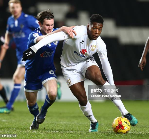 Chuks Aneke of Milton Keynes Dons attempts to move away with the ball under pressure from Aiden O'Neill of Oldham Athletic during the Sky Bet League...