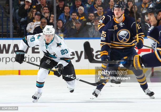 Marcus Sorensen of the San Jose Sharks skates against Jack Eichel of the Buffalo Sabres in his first NHL game at the KeyBank Center on February 7,...
