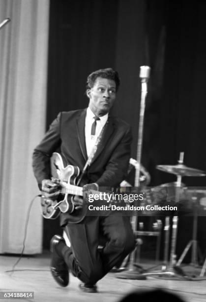 Rock and roll musician Chuck Berry performs onstage with a Gibson electric guitar in the East Village in 1966 in New York City, New York.