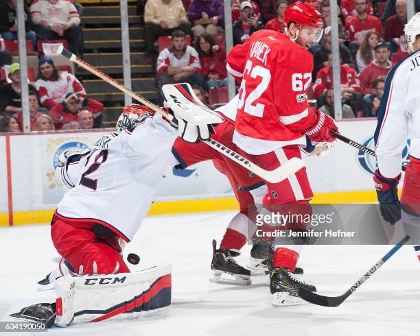 Sergei Bobrovsky of the Columbus Blue Jackets makes a save as Thomas Vanek of the Detroit Red Wings screens him infront of the net during an NHL game...