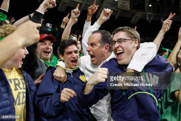 Head coach Mike Brey of the Notre Dame Fighting Irish celebrates with after the game against the Wake Forest Demon Deacons at Purcell Pavilion on...