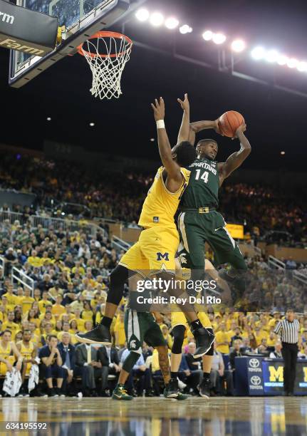 Eron Harris of the Michigan State Spartans grabs a rebound against the Michigan Wolverines at Crisler Arena on February 7, 2017 in Ann Arbor,...