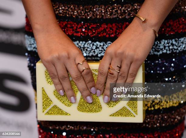 Actress Yara Shahidi, clutch, jewelry and manicure detail, arrives at the 15th Annual Visual Effects Society Awards at The Beverly Hilton Hotel on...