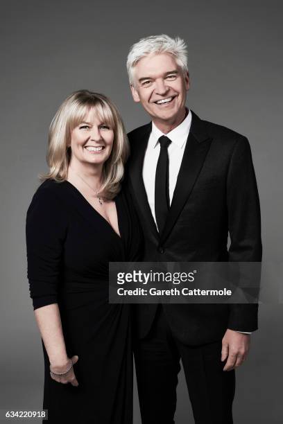 Tv presenter is Phillip Schofield is photographed with his wife Stephanie Lowe at the National Television Awards on January 25, 2017 in London,...