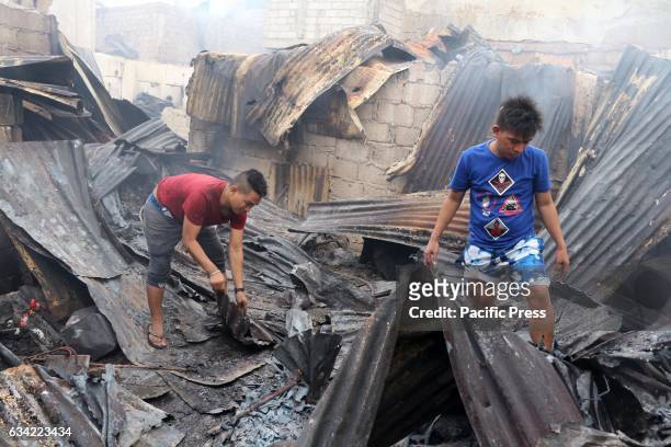 The fire victims collecting some metal that they can be used or sold to the junk shop to get money for their family. More than 1,100 houses and more...