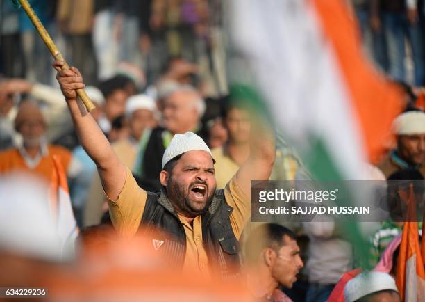 An Indian supporters of the Congress and Samajwadi political parties shouts slogans during an election rally by Congress Party leader Rahul Gandhi...