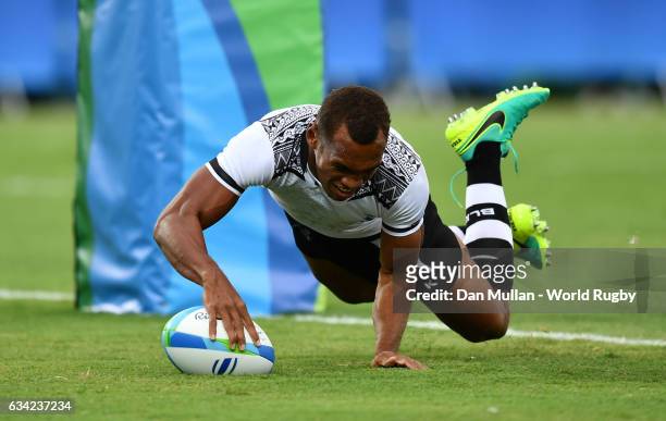 Osea Kolinisau of Fiji dives over for a try during the Men's Rugby Sevens Pool A match between Fiji and the United States on Day five of the Rio 2016...