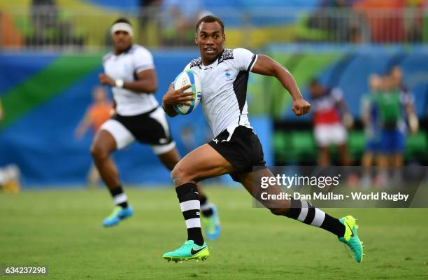 Osea Kolinisau of Fiji makes a break to score a try during the Men's Rugby Sevens Pool A match between Fiji and the United States on Day five of the...