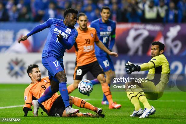 Obafemi Martins of Shanghai Shenhua and Jamie Maclaren of Brisbane Roar compete for the ball during the AFC Champions League 2017 play-off match...