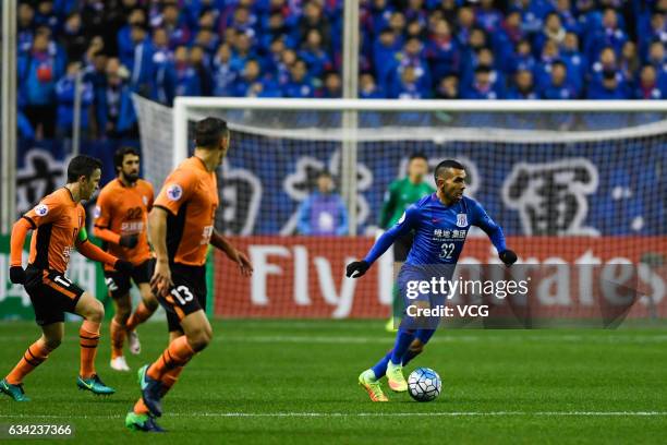 Carlos Tevez of Shanghai Shenhua drives the ball during the AFC Champions League 2017 play-off match between Shanghai Shenhua and Brisbane Roar at...