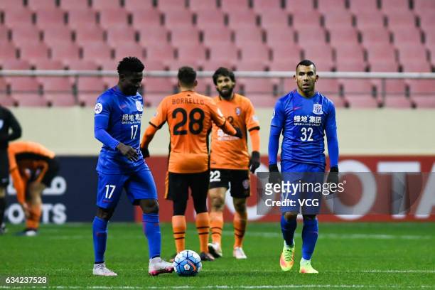 Carlos Tevez and Obafemi Martins of Shanghai Shenhua reacts after losing the second goal during the AFC Champions League 2017 play-off match between...