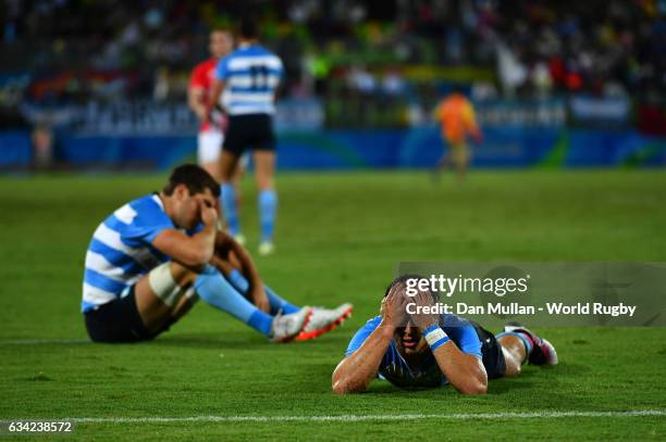 Bautista Ezcurra of Argentina lies dejected following an extra time try by Dan Bibby of Great Britain to win the match during the Men's Rugby Sevens...